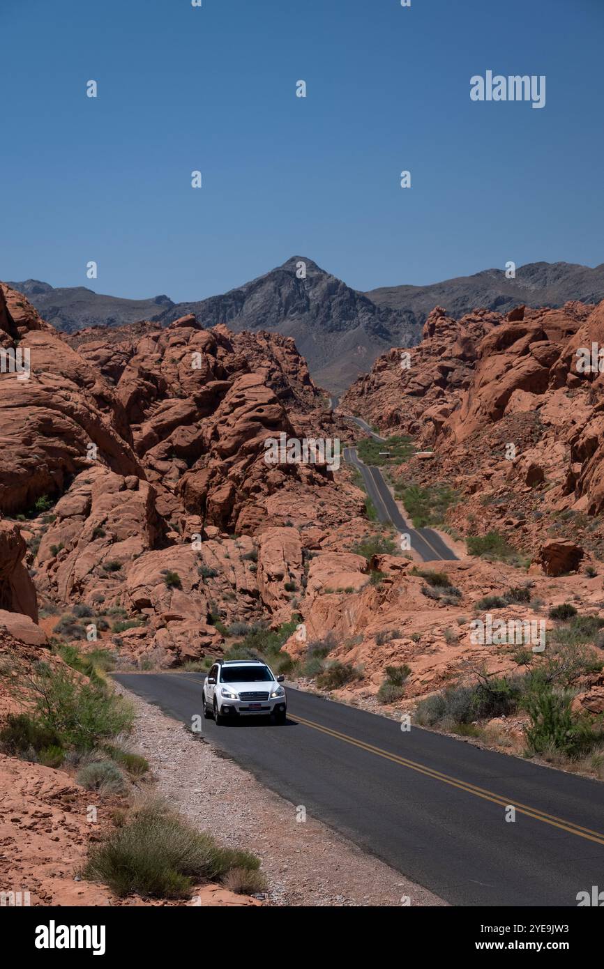 Motor Vehicle travelling the highway of Mouses Tank Road through Valley of Fire State Park, Nevada, United States of America, North America Stock Photo