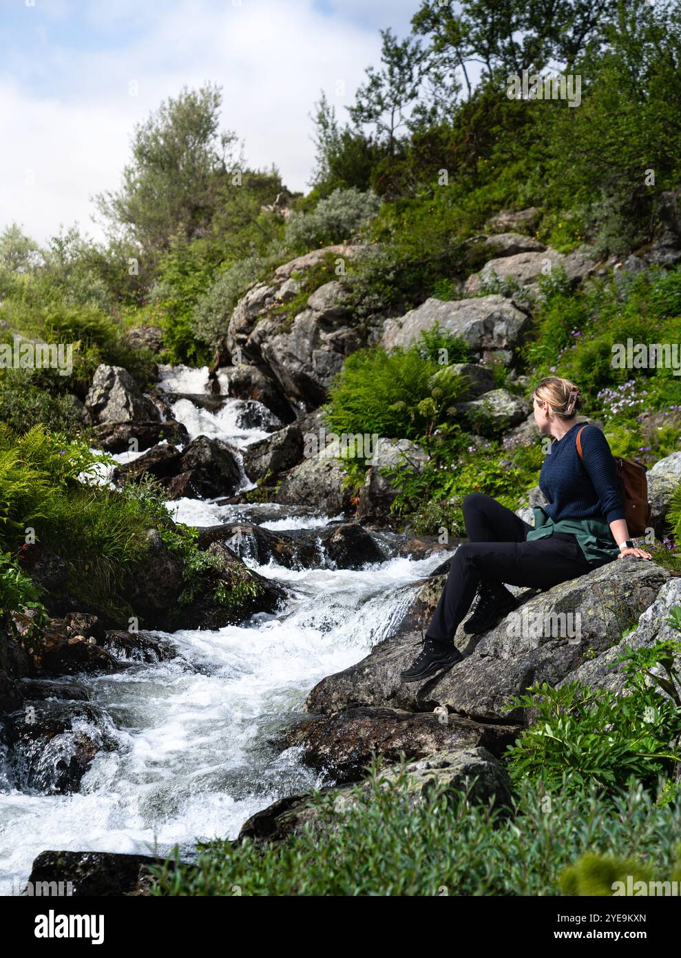 Female hiker sitting waterfall hi-res stock photography and images - Alamy