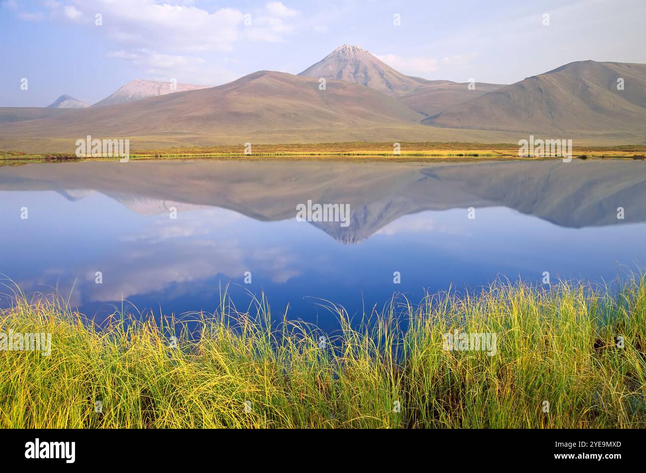 Ogilvie Mountains reflected in a lake in Norther Canada; Yukon, Canada Stock Photo