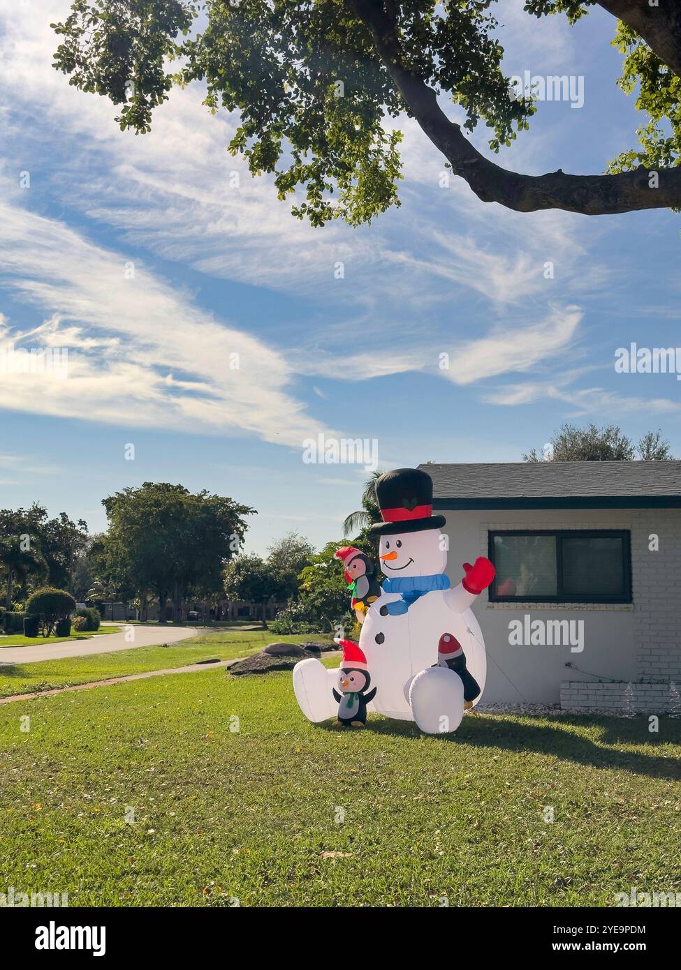 House with inflatable Chrsitmas decoration, Plantation, Florida, USA - Smartphone Captured Stock Image