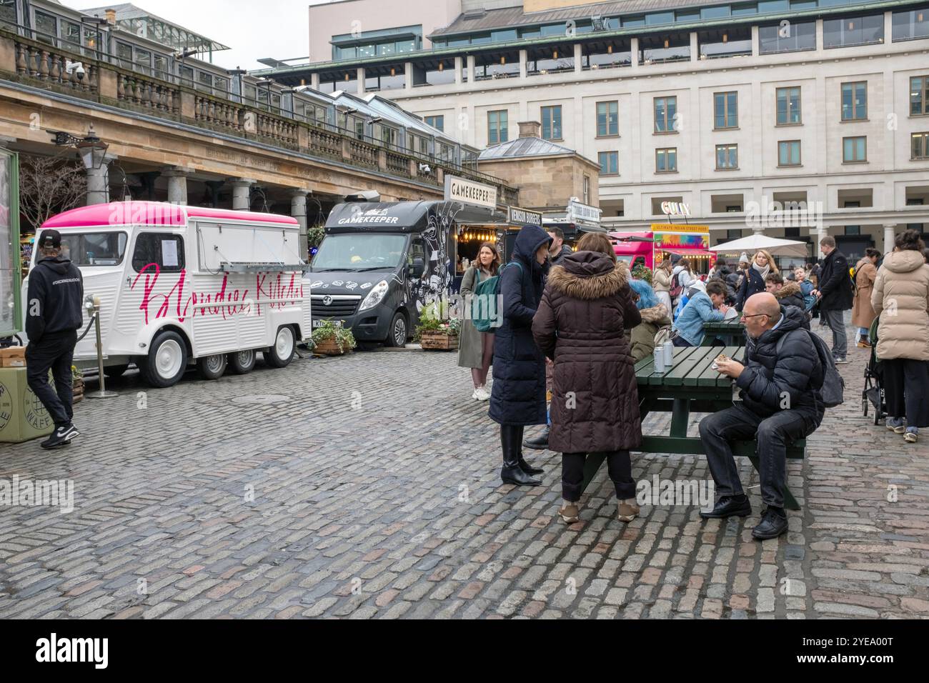 Covent Garden, London, UK. Lots of people milling around, shopping and ...