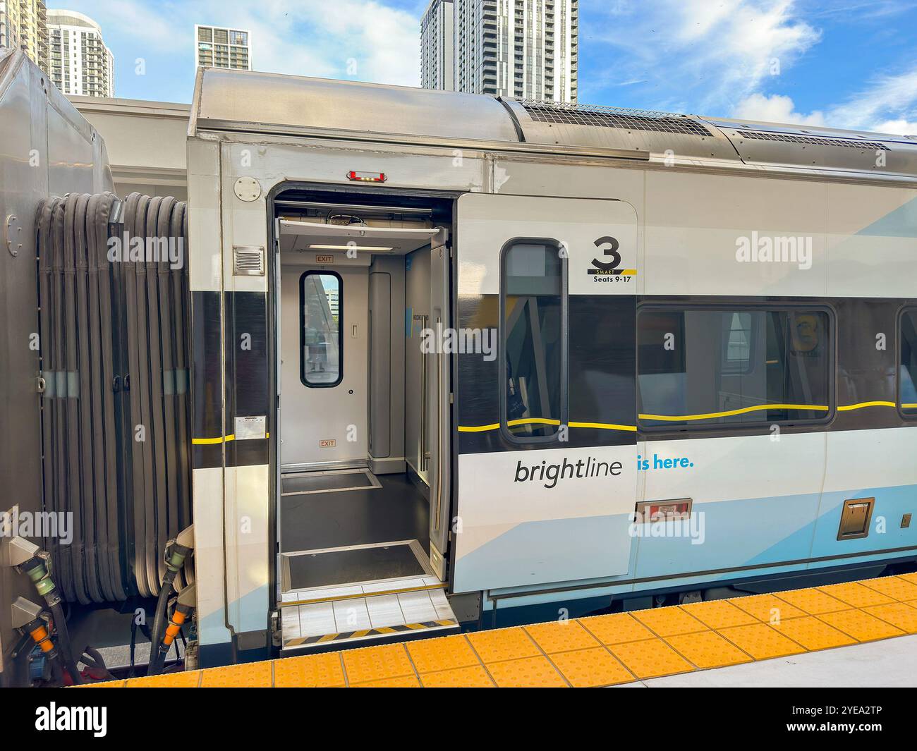 Fort Lauderdale, Florida, USA - 2 December 2023: Open door on a coach on a fast express train operated by Brightline between Miami and Orlando. - Smartphone Captured Stock Image