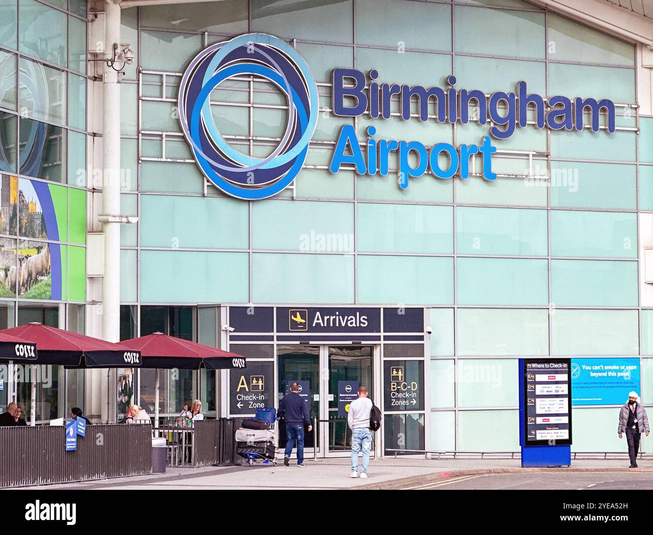 Birmingham, West Midlands, UK: Exterior view of the arrivals entrance of the Birmingham airport terminal building. - Smartphone Captured Stock Image