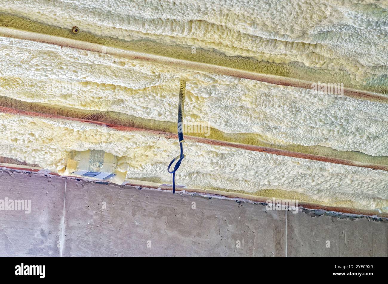 Running Isulation View of ceiling of building with insulation pipes running through it ...