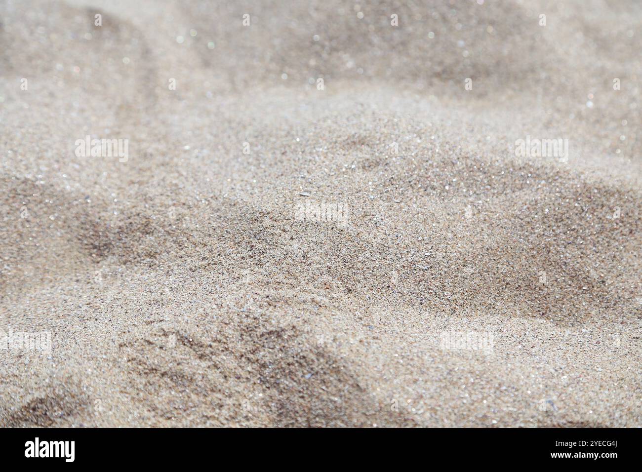 Sand background. Uneven gray sand close up. Stock Photo