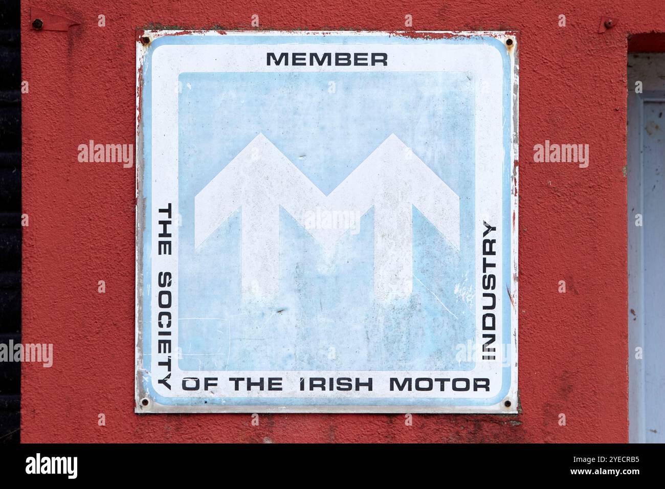 old faded sign for the member of the society of the irish motor industry on a garage in Cong, county mayo, republic of ireland Stock Photo