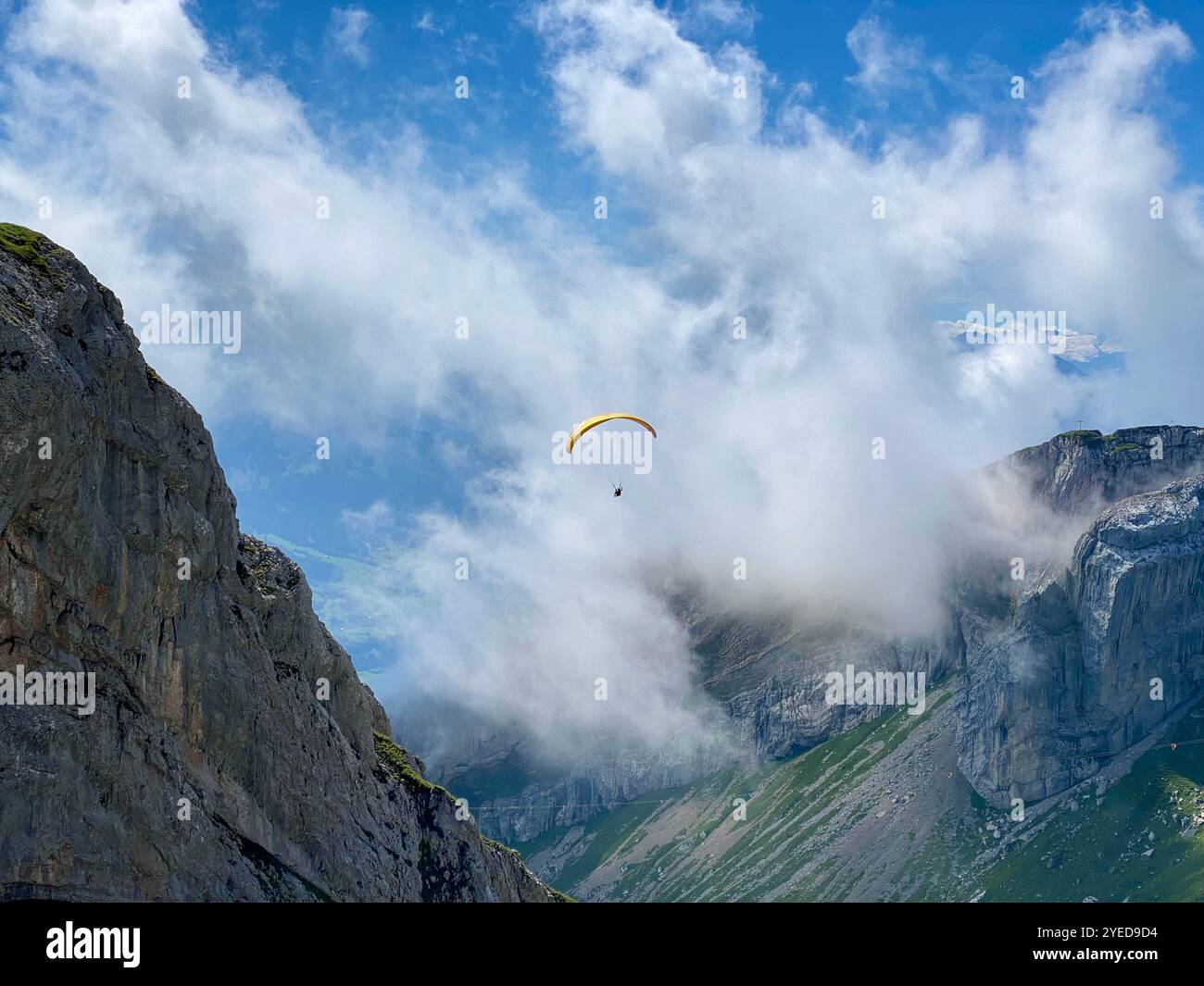 Adventurous Paragliding Above Breathtaking Mountainous Landscape in Switzerland - Smartphone Captured Stock Image