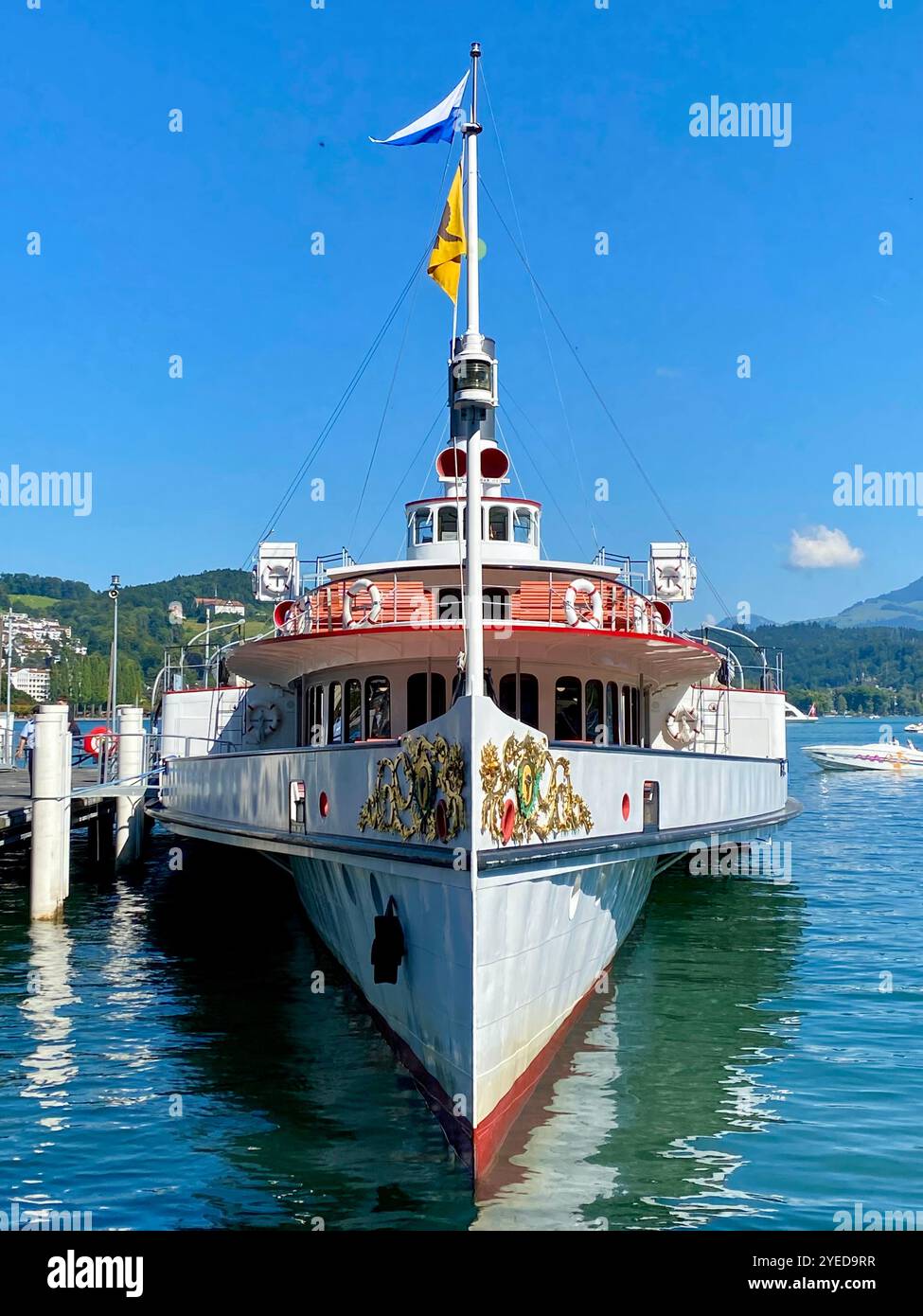 Vintage Paddle Steamer Docked in a Pier in Lucern Switzerland on a Sunny Day - Smartphone Captured Stock Image