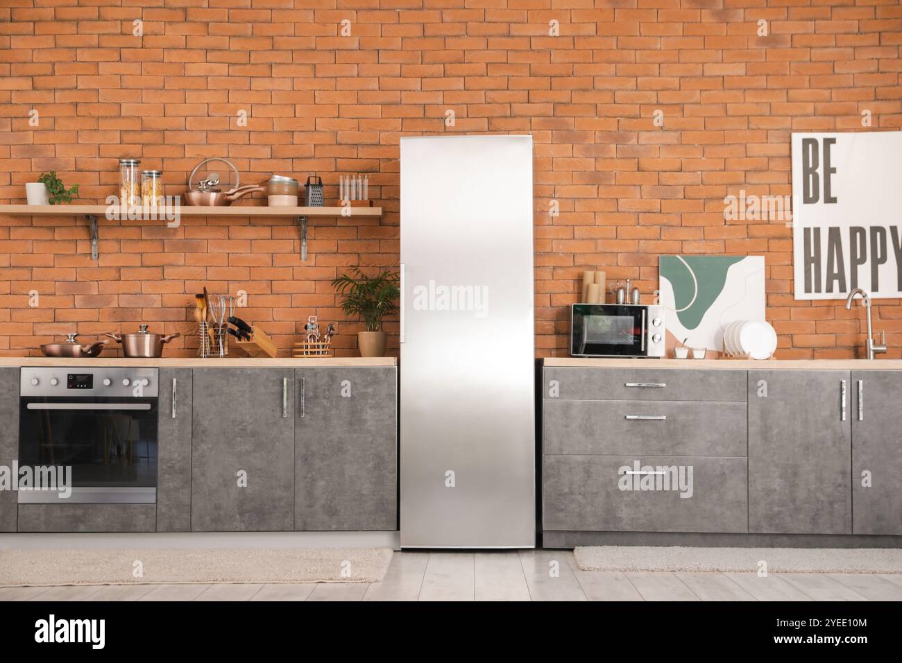 Interior of modern kitchen with silver fridge, counters and shelf Stock ...