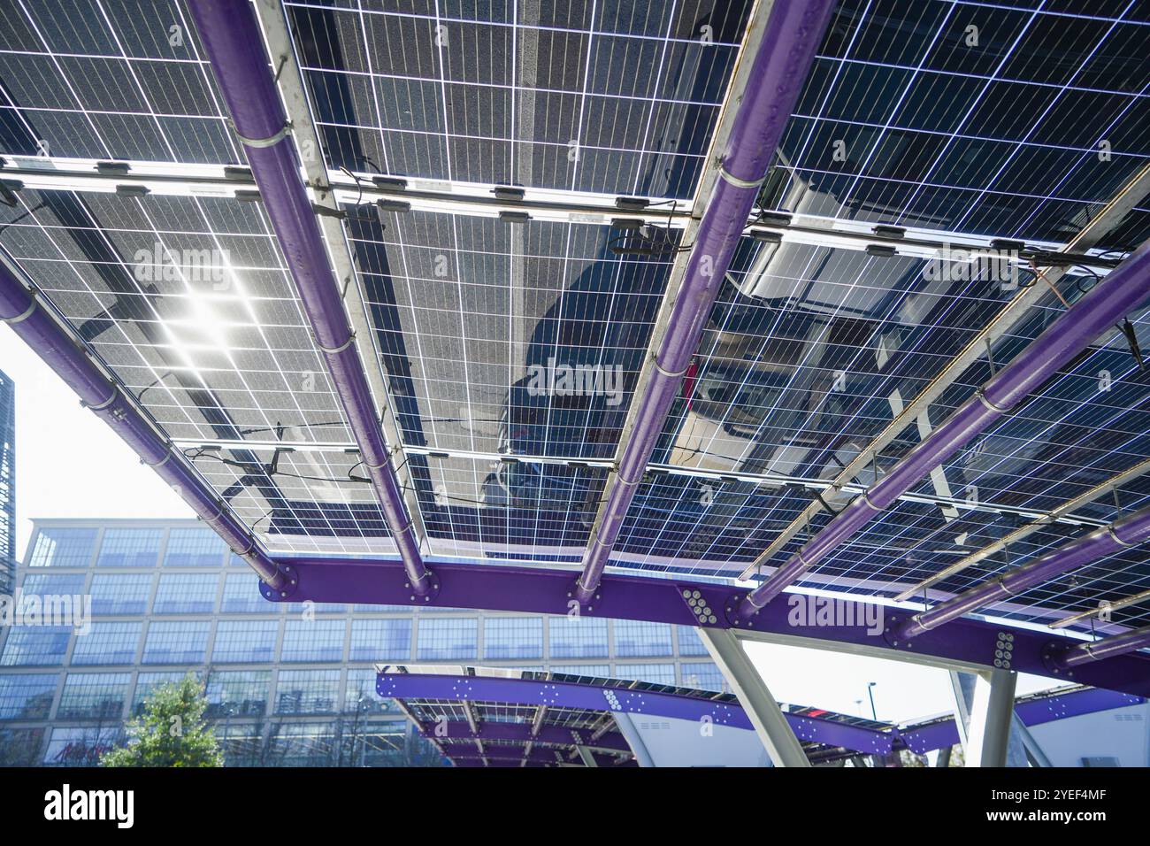 Innovative car park with solar canopies. Companies are installing renewable energy sources to reduce their carbon footprint..  Turin, Italy - October Stock Photo