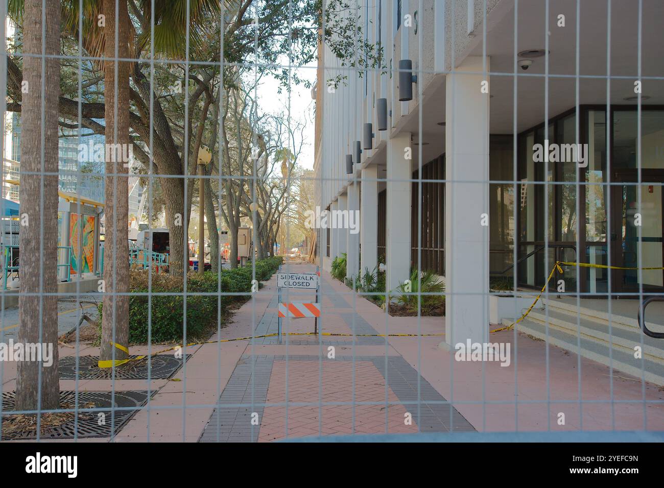 Orange and white sidewalk closed sign hi-res stock