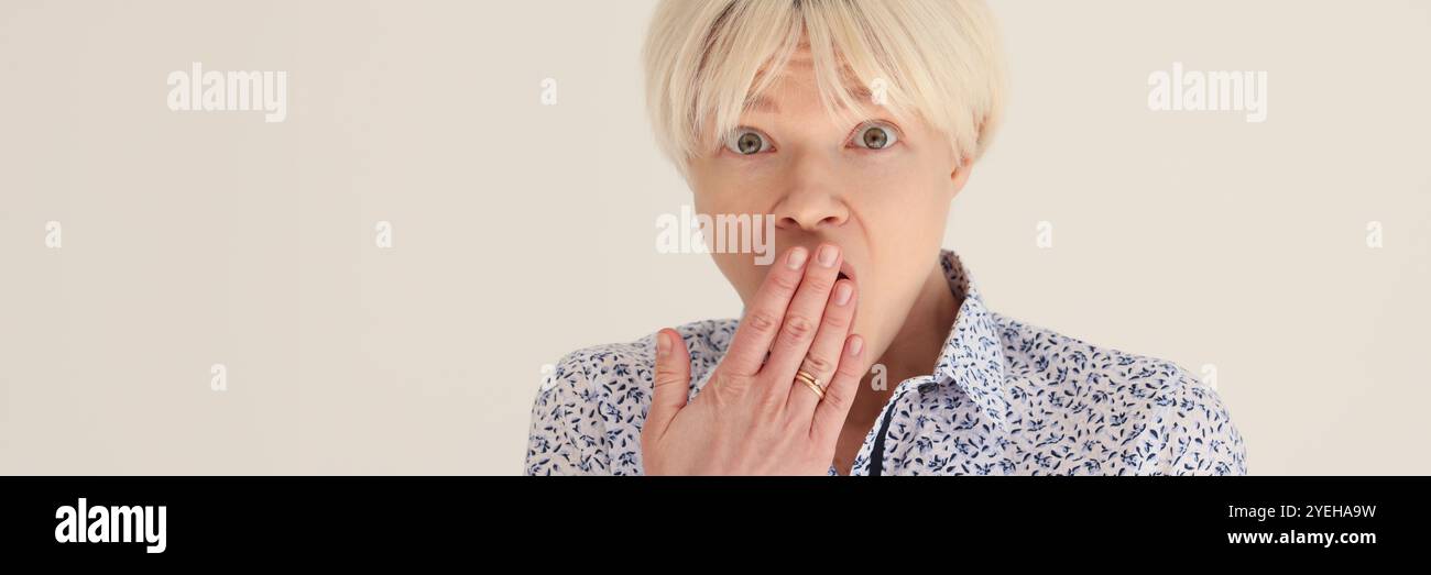 Woman surprised covers mouth palm hi-res stock photography and images ...