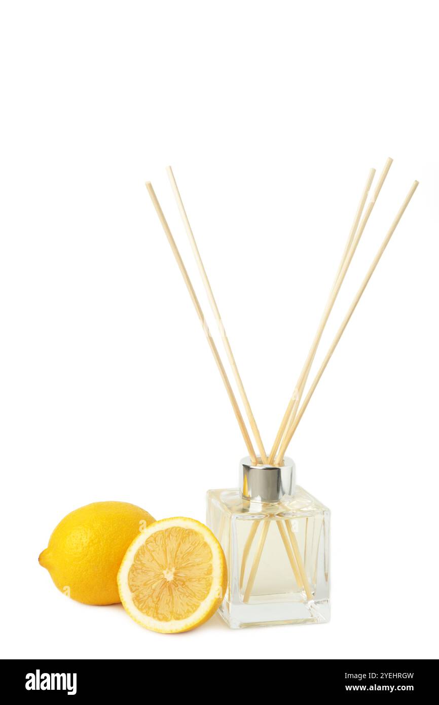 Reed diffuser and lemons isolated on white background. Top view Stock Photo