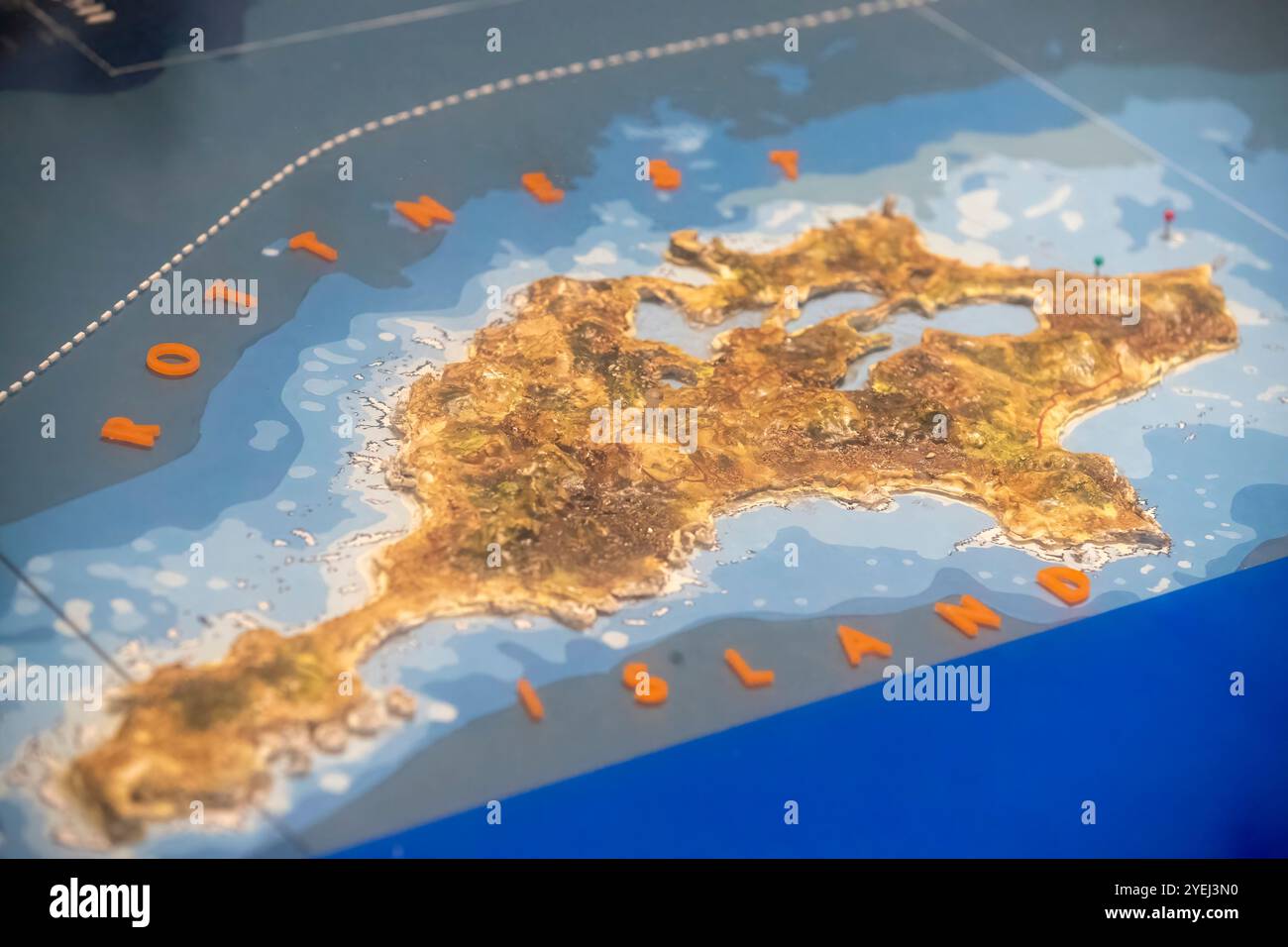 A 3D topographic map model of Rottnest Island, showing detailed elevation and geographic features with vibrant colors. Stock Photo