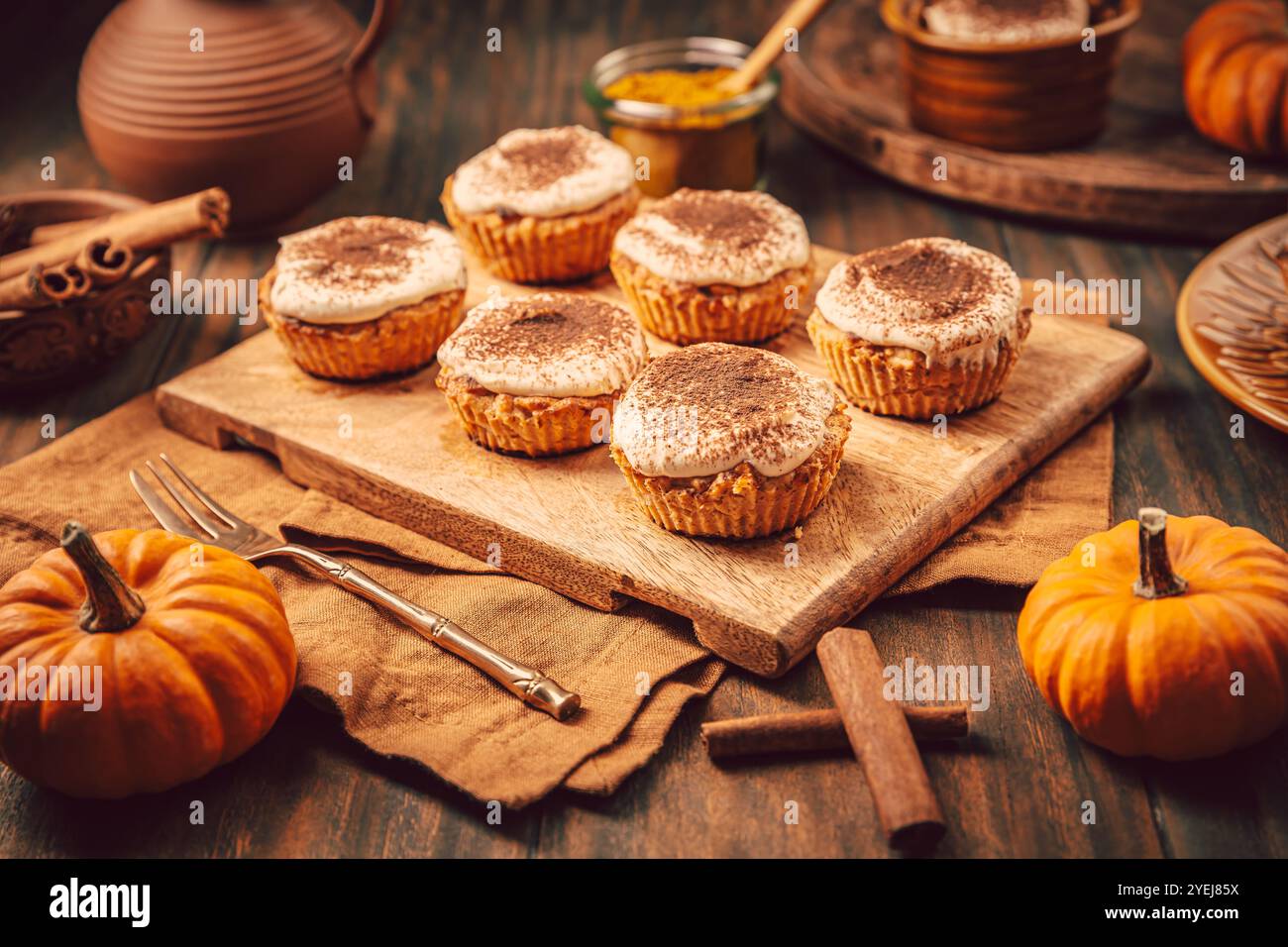 Homemade pumpkin muffins with cheesecake icing Stock Photo