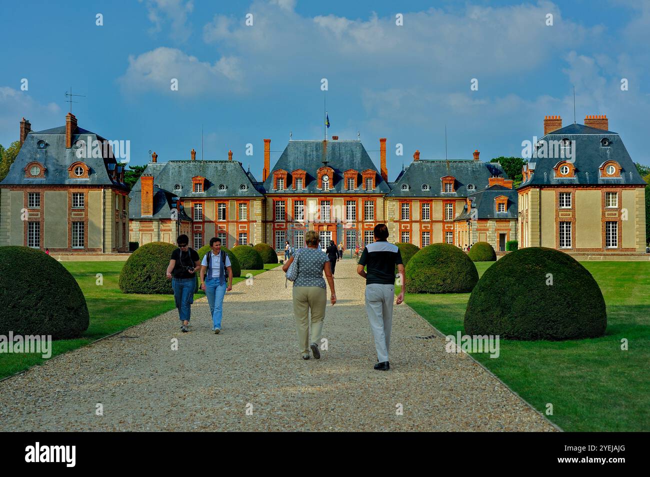 Choisiel, France - Groups of People, Tourists Visiting French Monument, Walking From Behind, Chateau de Breteuil, Stock Photo