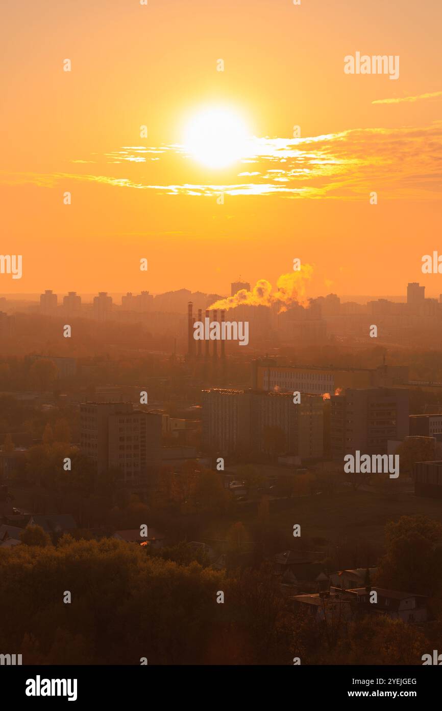 Evening view of the city. Sunset orange sky and beautiful cityscape ...