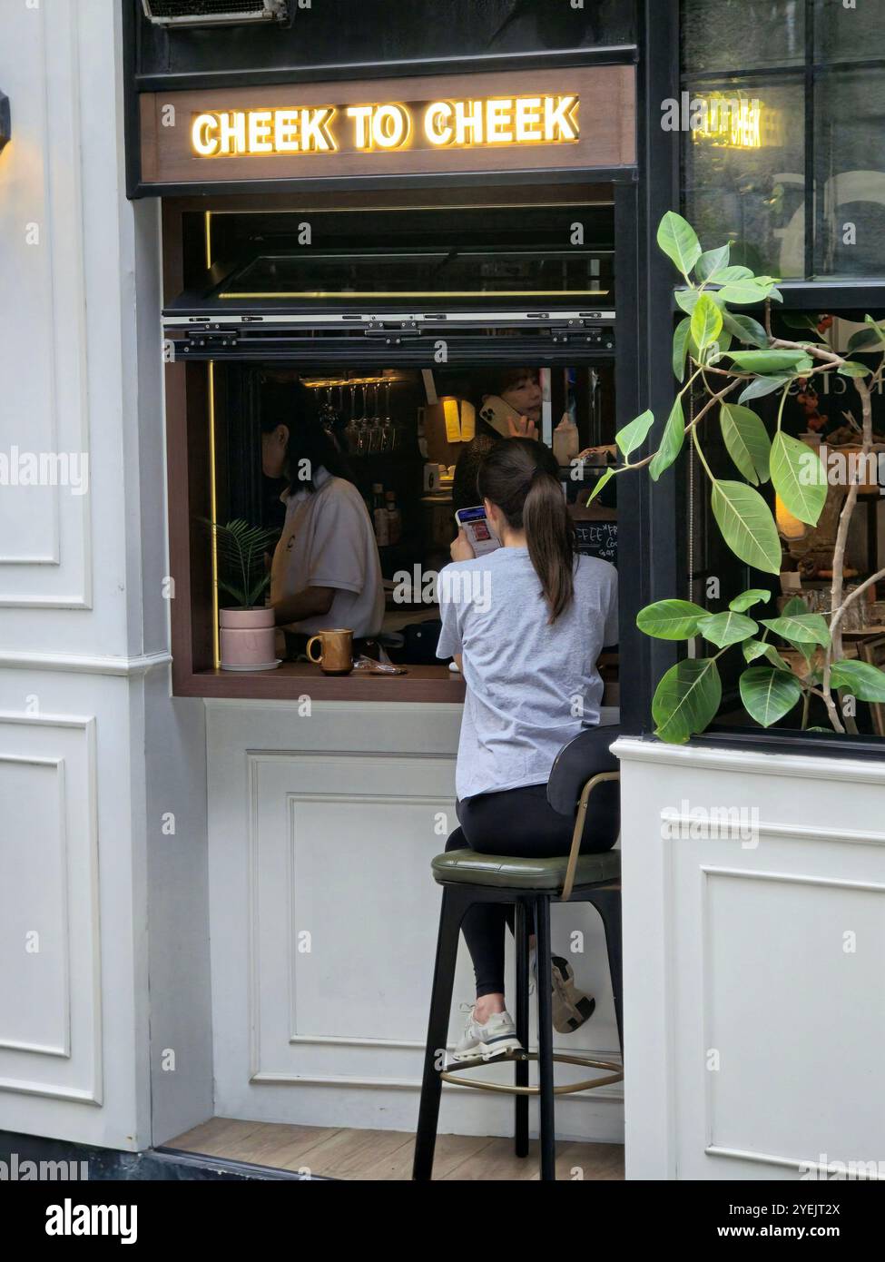 The Cheek to Cheek bar on the corner of Staunton street and Old Bailey Street in Soho, Central, Hong Kong. - Smartphone Captured Stock Image