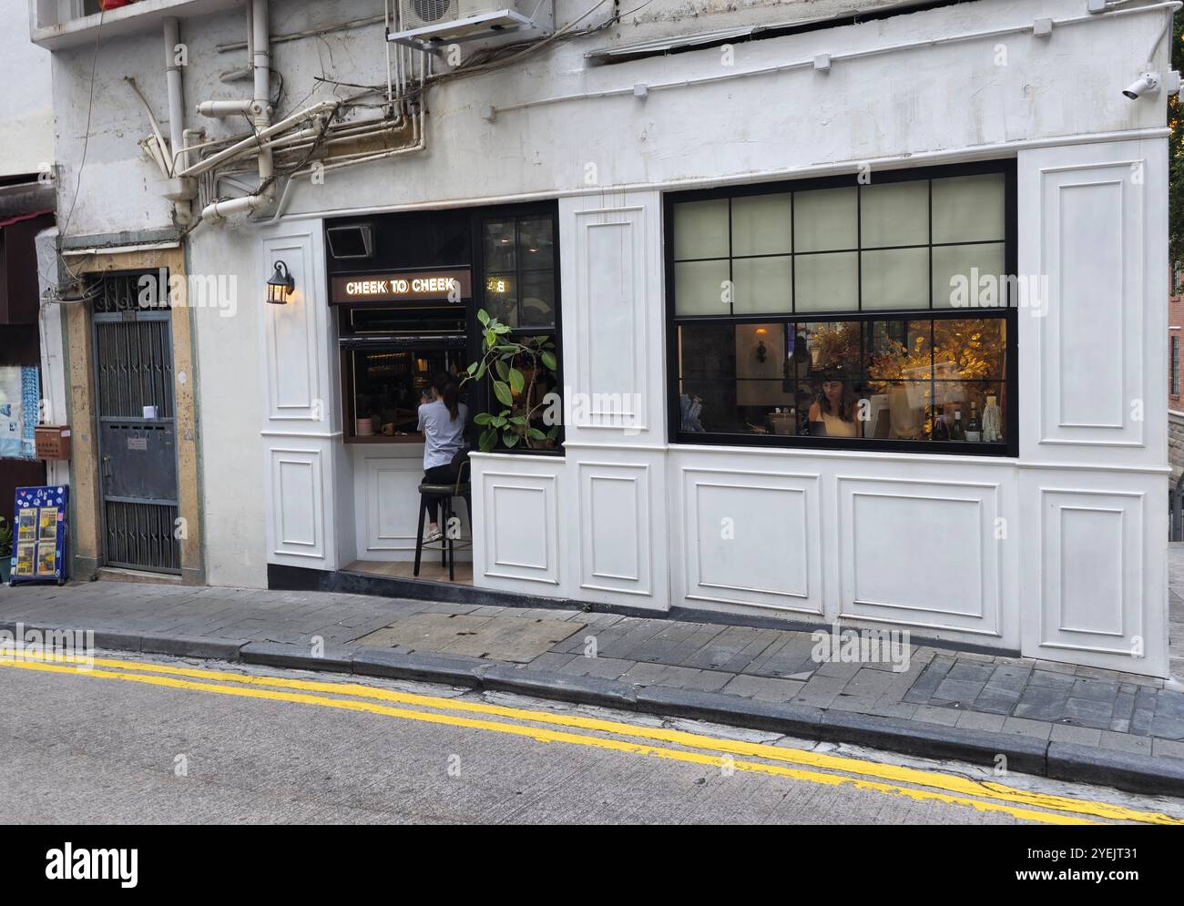 The Cheek to Cheek bar on the corner of Staunton street and Old Bailey Street in Soho, Central, Hong Kong. - Smartphone Captured Stock Image