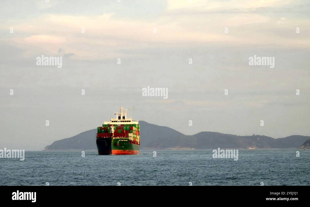 The MTT Port Kelang container ship crossing the East Lamma Channel in Hong Kong. Stock Photo