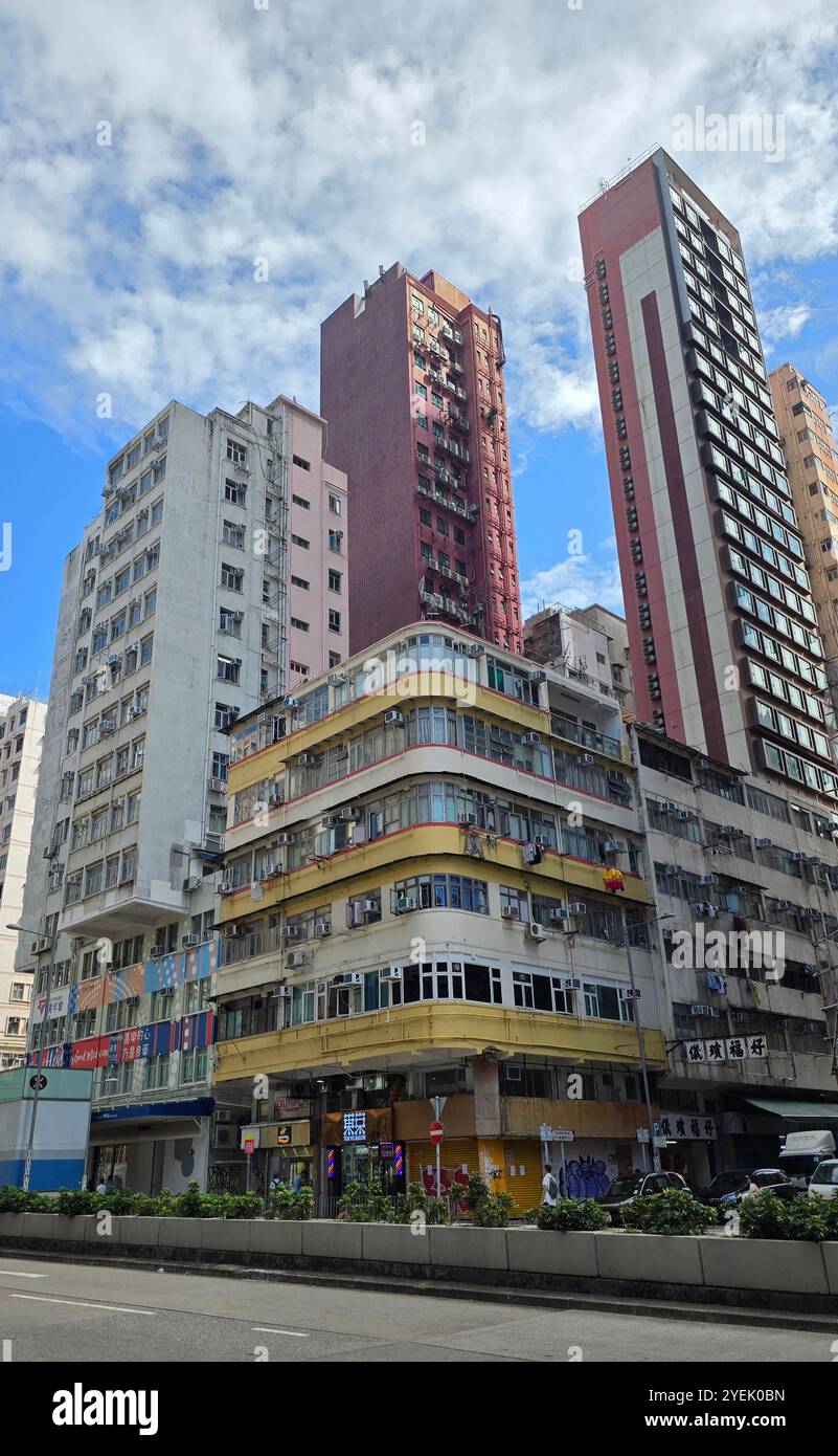 A view of older and newer buildings on the corner of Waterloo Road and Portland street in Yau Ma Tei, Kowloon, Hong Kong. - Smartphone Captured Stock Image