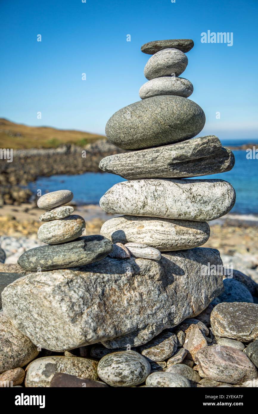 Pebble stack balanced on the sea shore Stock Photo