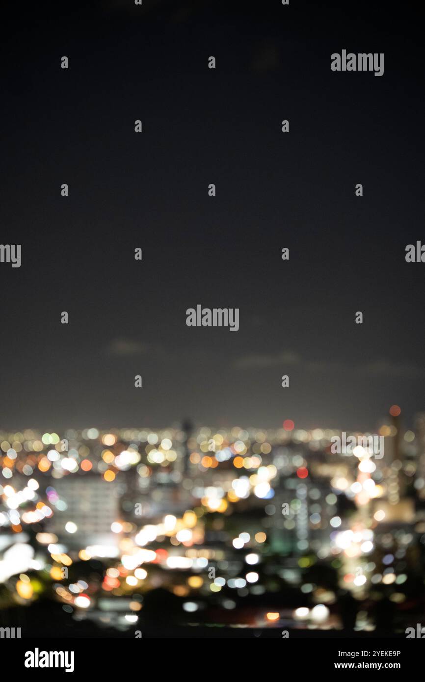 Blurred city night lights creating a background. Stock Photo
