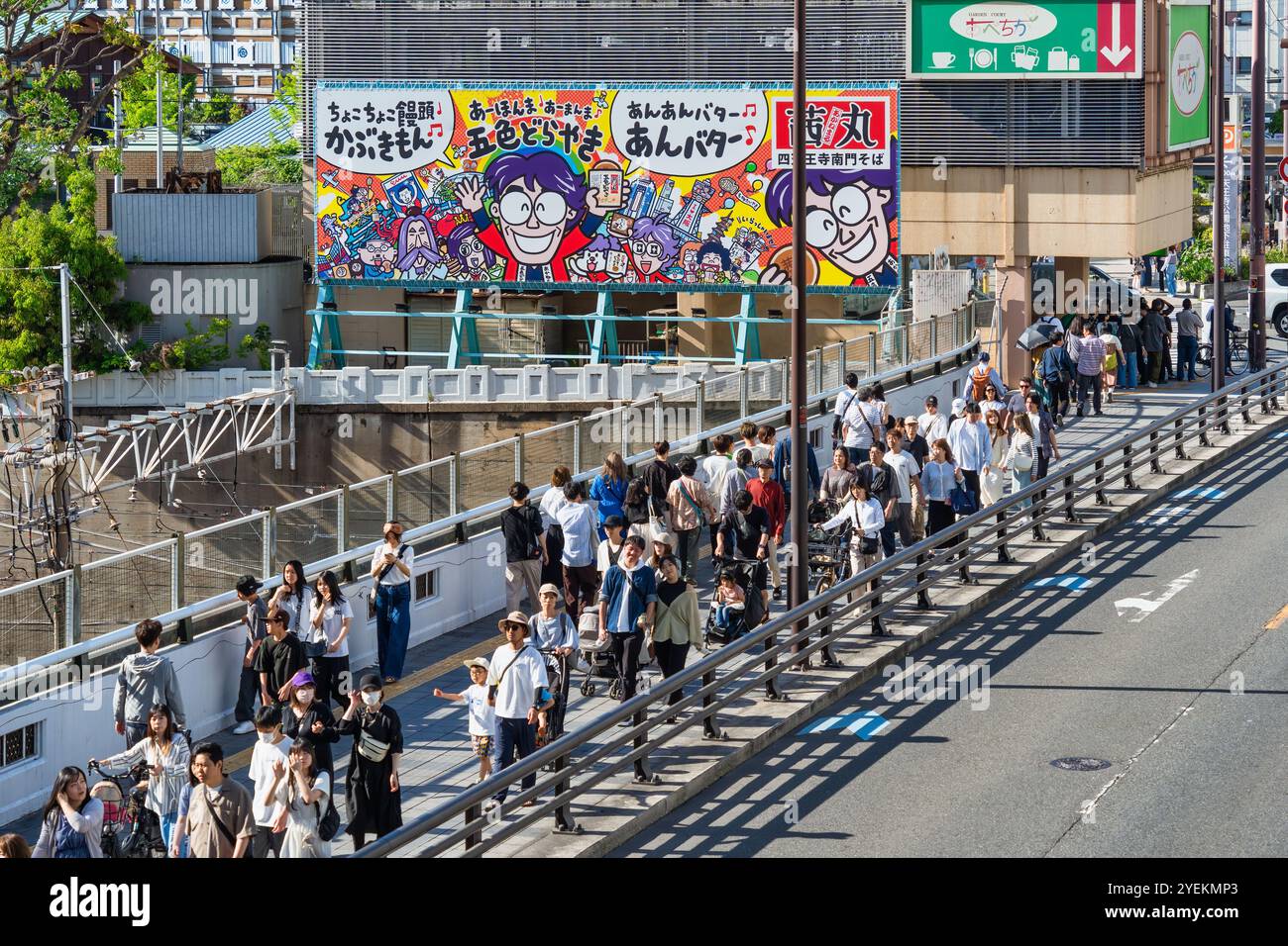 Osaka, Japan - 05.05.2024: Crowd of people on the sidewalk inTennoji area Stock Photo