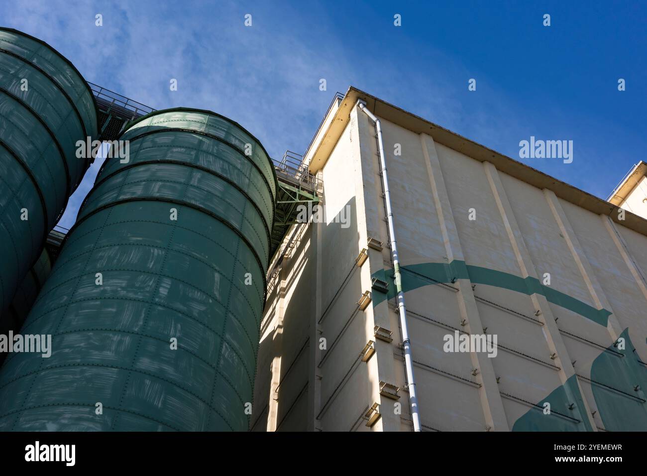 Industrial grain silos and bakery building under a clear blue sky Stock ...