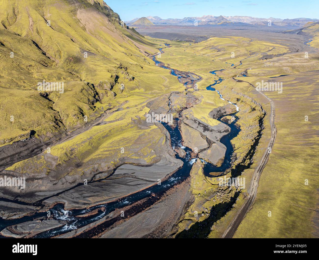 Road F232 Öldufellsleid, along northern slopes of glacier Myrdalsjökull and moss-covered Mt. Öldufell, Mt. Maelifell in the back, black lava sand, aer Stock Photo