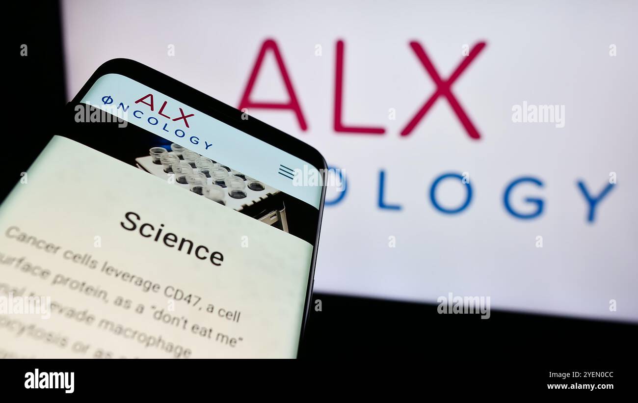 Germany. 03rd July, 2024. In this photo illustration, a mobile phone with the webpage of US cancer therapy company ALX Oncology Inc. is seen in front of business logo. (Photo by Timon Schneider/SOPA Images/Sipa USA) *** Strictly for editorial news purposes only *** Credit: Sipa USA/Alamy Live News Stock Photo