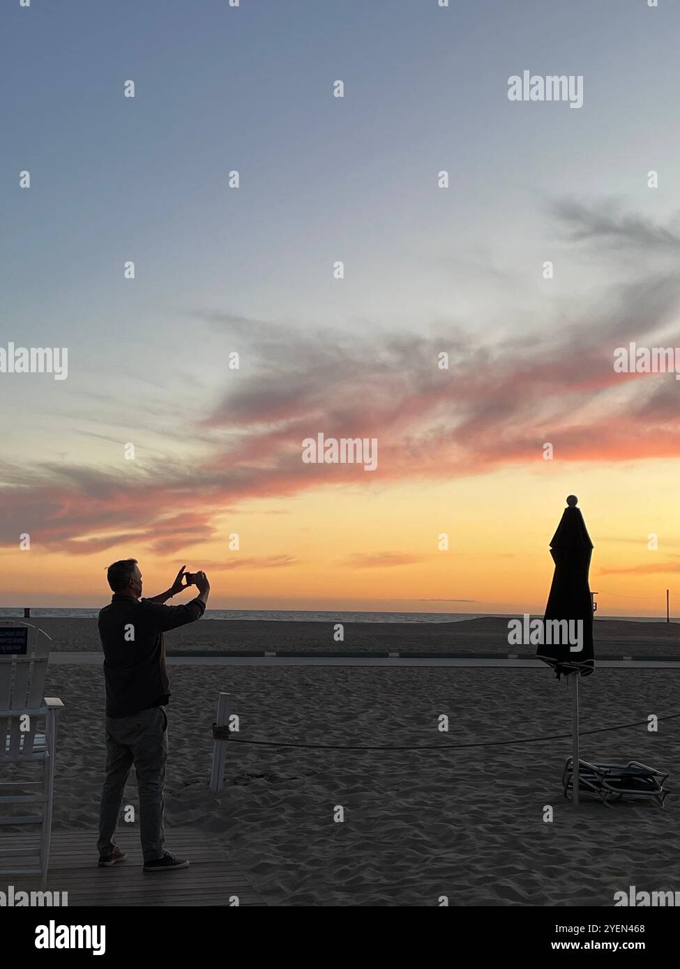 photographing the sunset - Smartphone Captured Stock Image