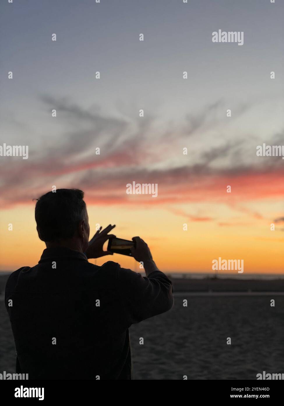 photographing the sunset - Smartphone Captured Stock Image