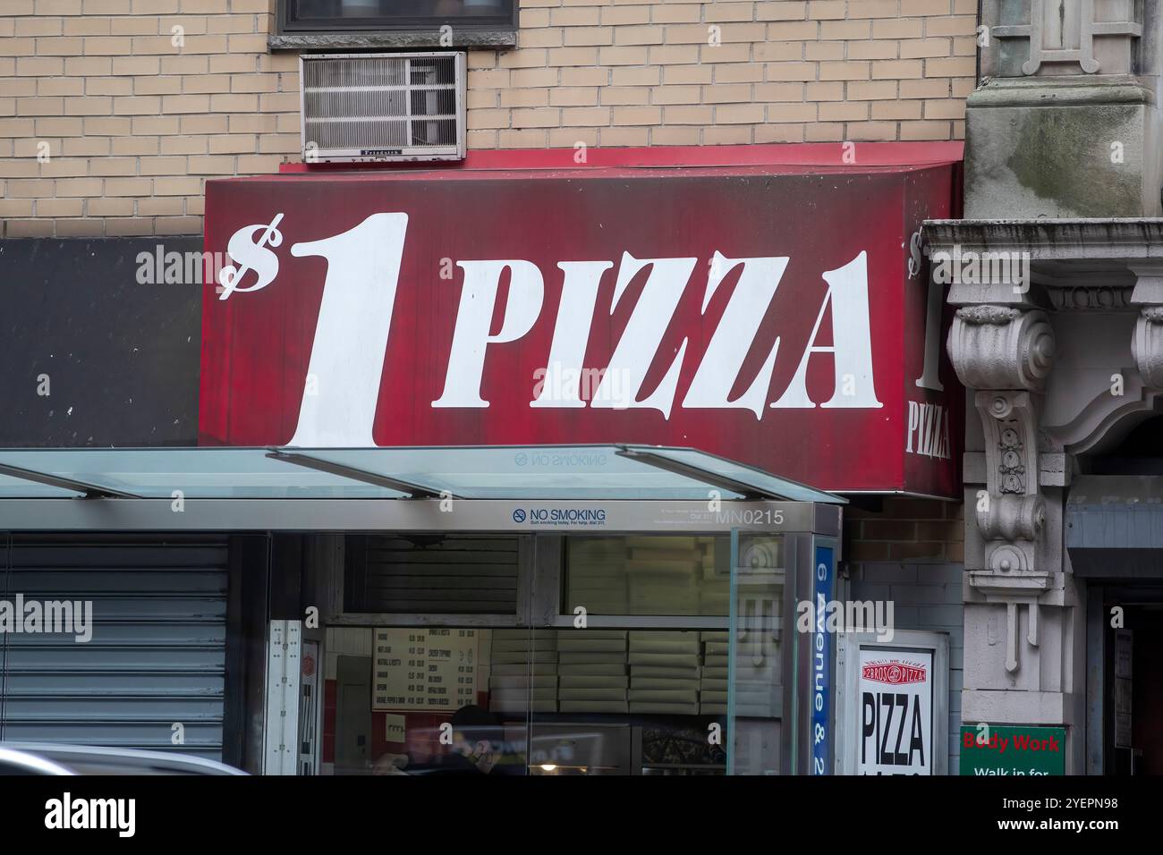 The image showcases a storefront with a large sign advertising