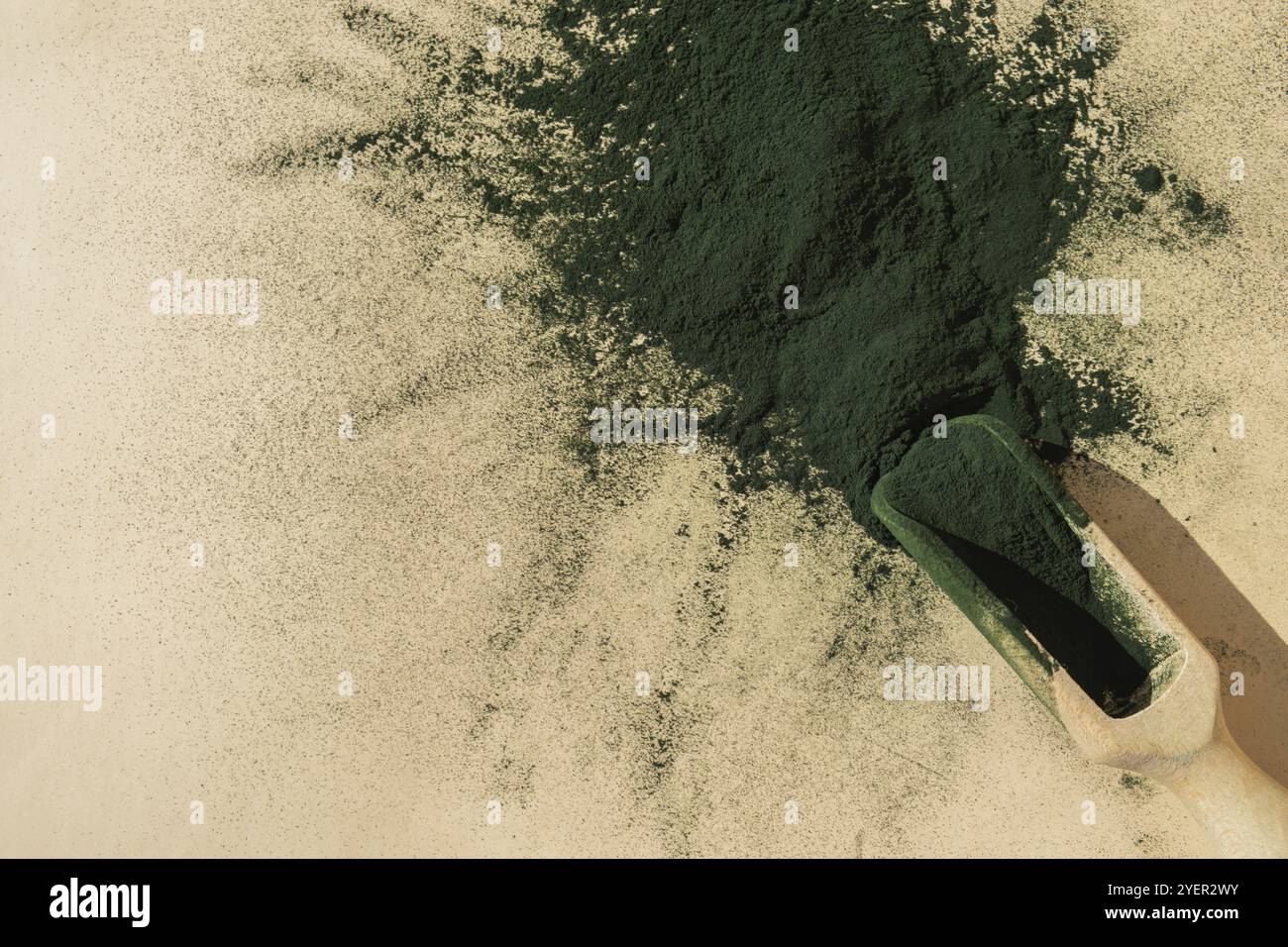 Organic blue-green algae spirulina powder food in wooden spoon. Copy ...