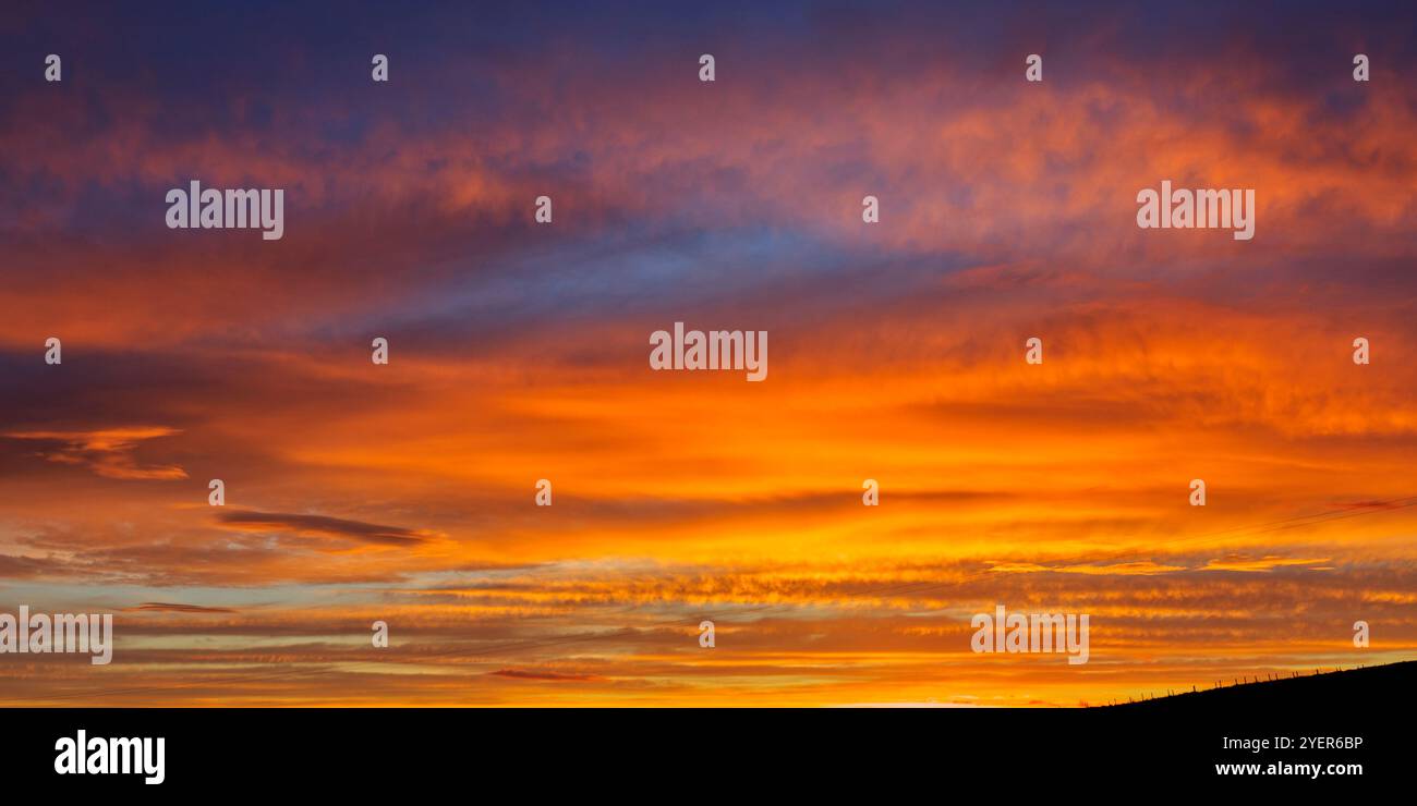 Firery red sky after sunset, Orkney Islands Stock Photo