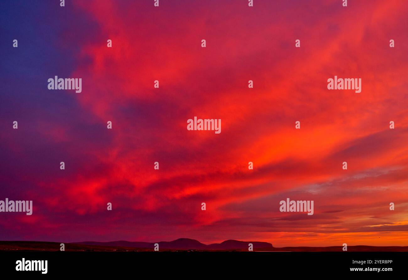 Firery red sky after sunset, Orkney Islands Stock Photo