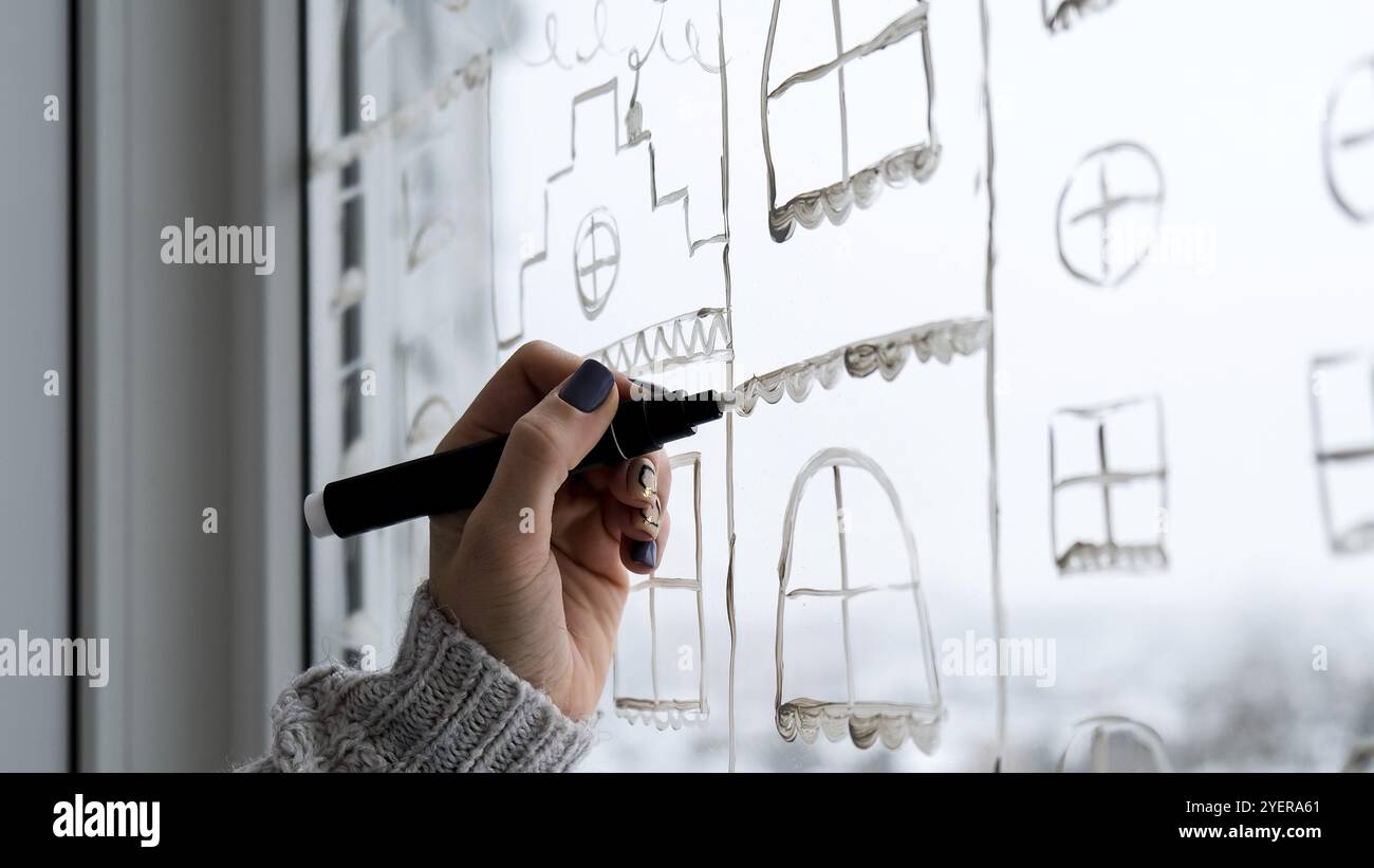 Female hand draws christmas holidays hi-res stock photography and ...