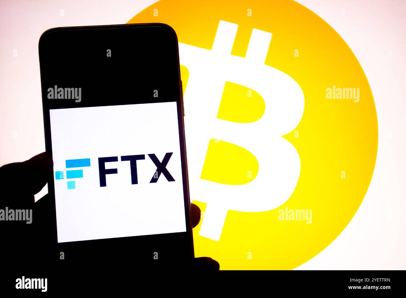 India. 28th Oct, 2024. In this photo illustration, a FTX logo seen displayed on a smartphone with a Bitcoin logo in the background. (Photo by Avishek Das/SOPA Images/Sipa USA) *** Strictly for editorial news purposes only *** Credit: Sipa USA/Alamy Live News Stock Photo