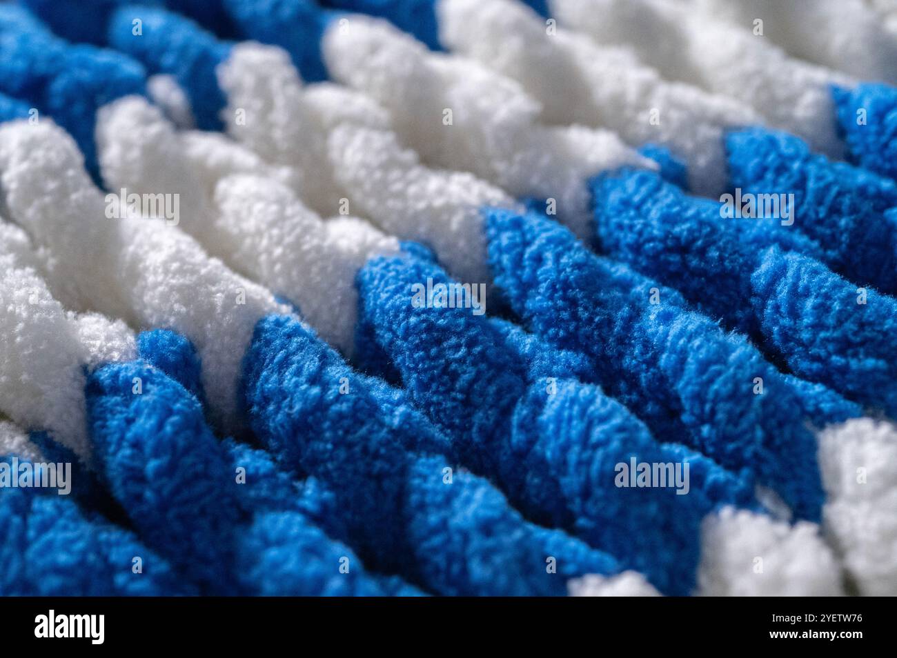 Cozy knitted multi-colored background. Fleece Stock Photo