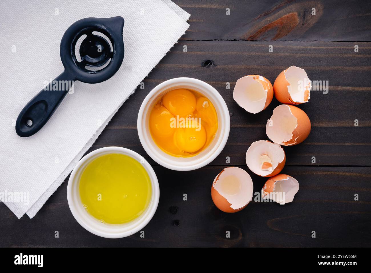 Four Separated Eggs in Small White Ramekins: Egg yolks and egg whites ...