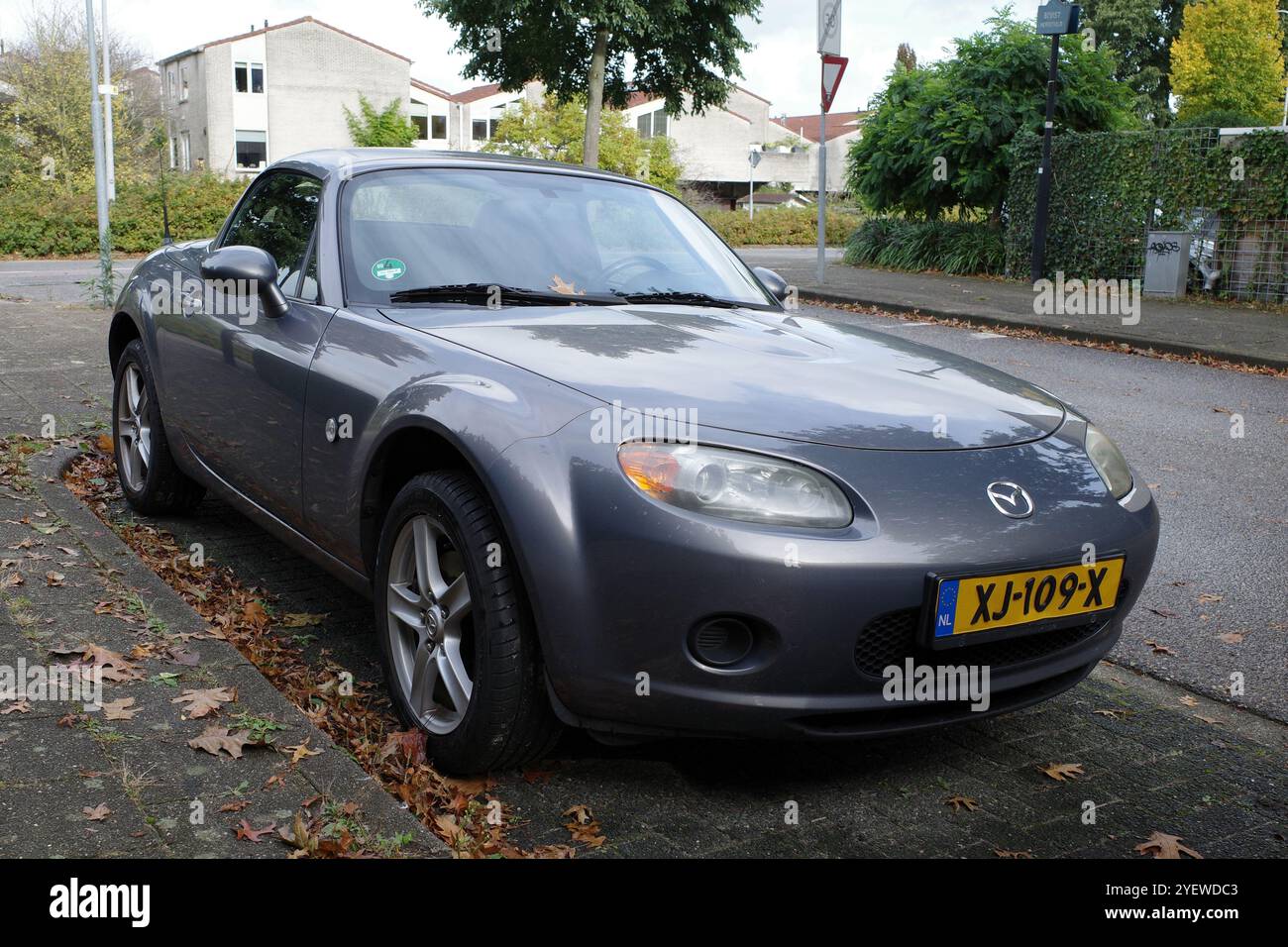 Amersfoort, Netherlands - Oct 13 2024 Front view on a parked grey Mazda MX5 from 2007 Stock Photo