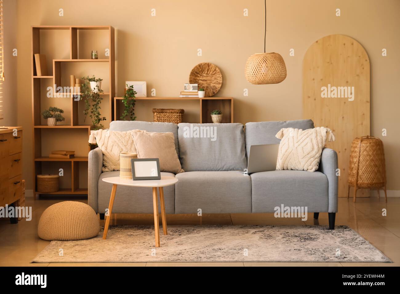 Stylish interior of living room with sofa and coffee table Stock Photo ...