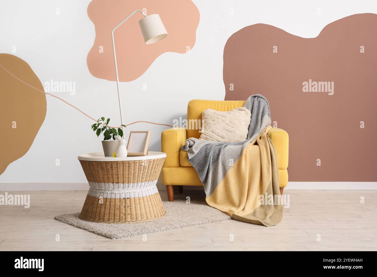 Interior of living room with lamp, armchair and table Stock Photo - Alamy