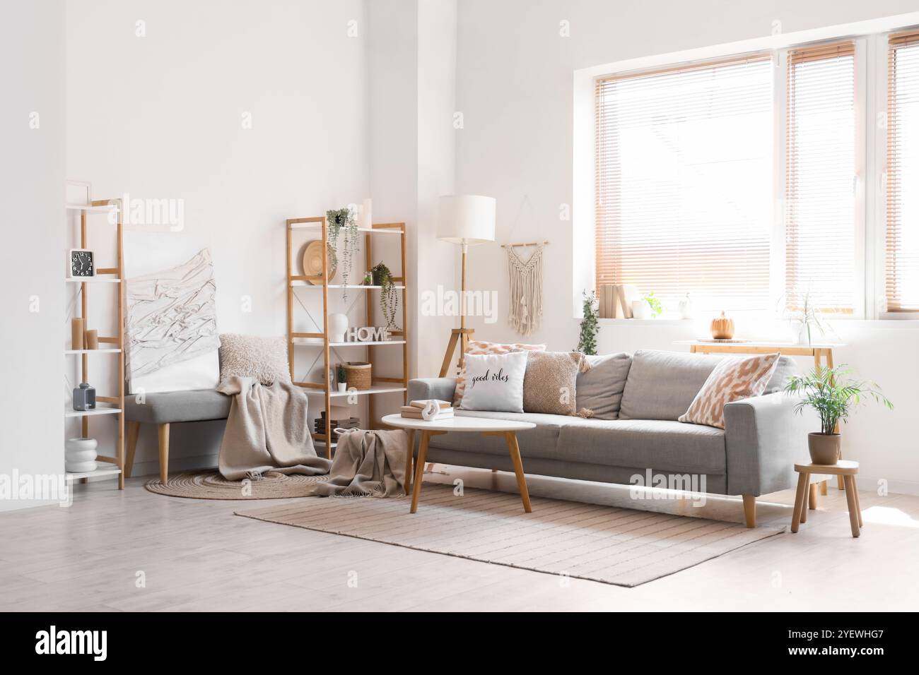 Interior of living room with cozy sofa, coffee table and bench Stock ...