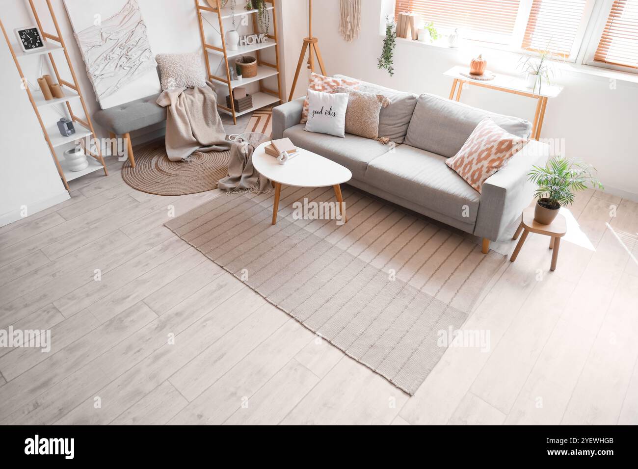 Interior of living room with cozy sofa, coffee table and bench Stock ...