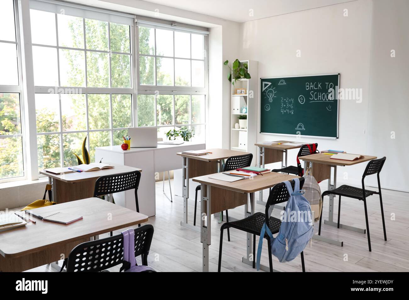 School desks backpacks books hi-res stock photography and images - Alamy