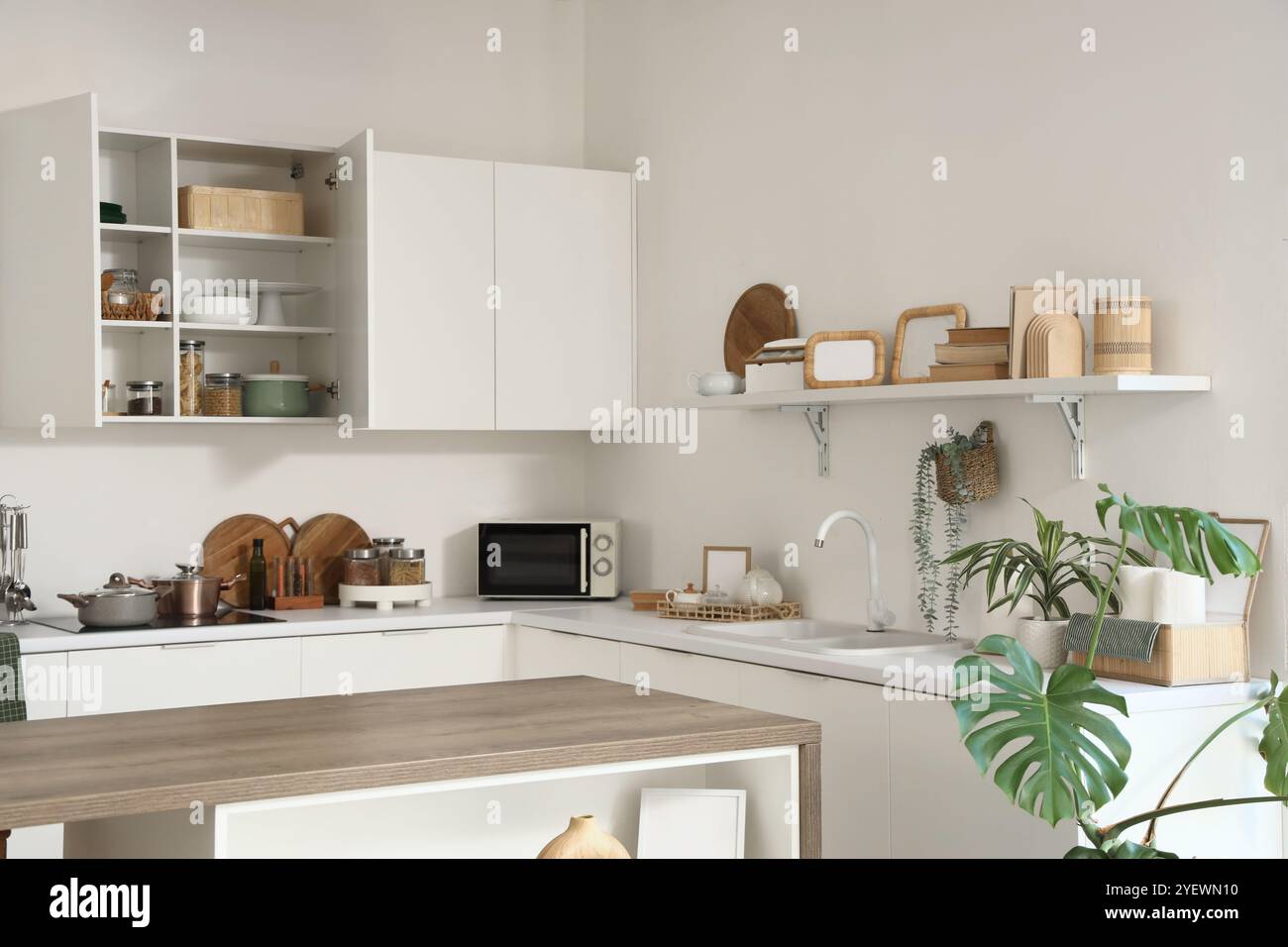 Interior of light kitchen with shelf, counters and cupboards Stock ...