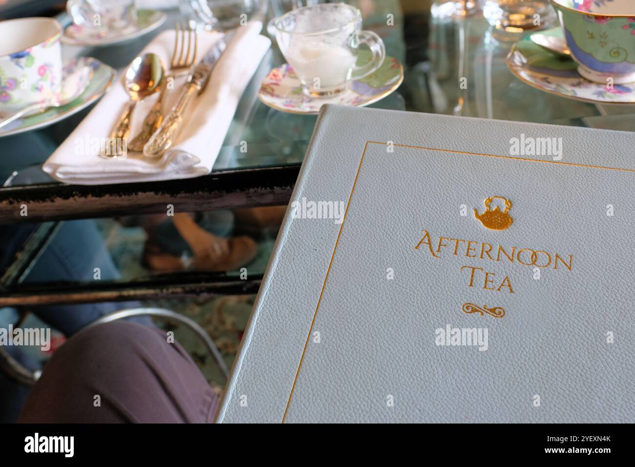High Tea Letters White Afternoon Tea hardcover menu with table settings in background ...