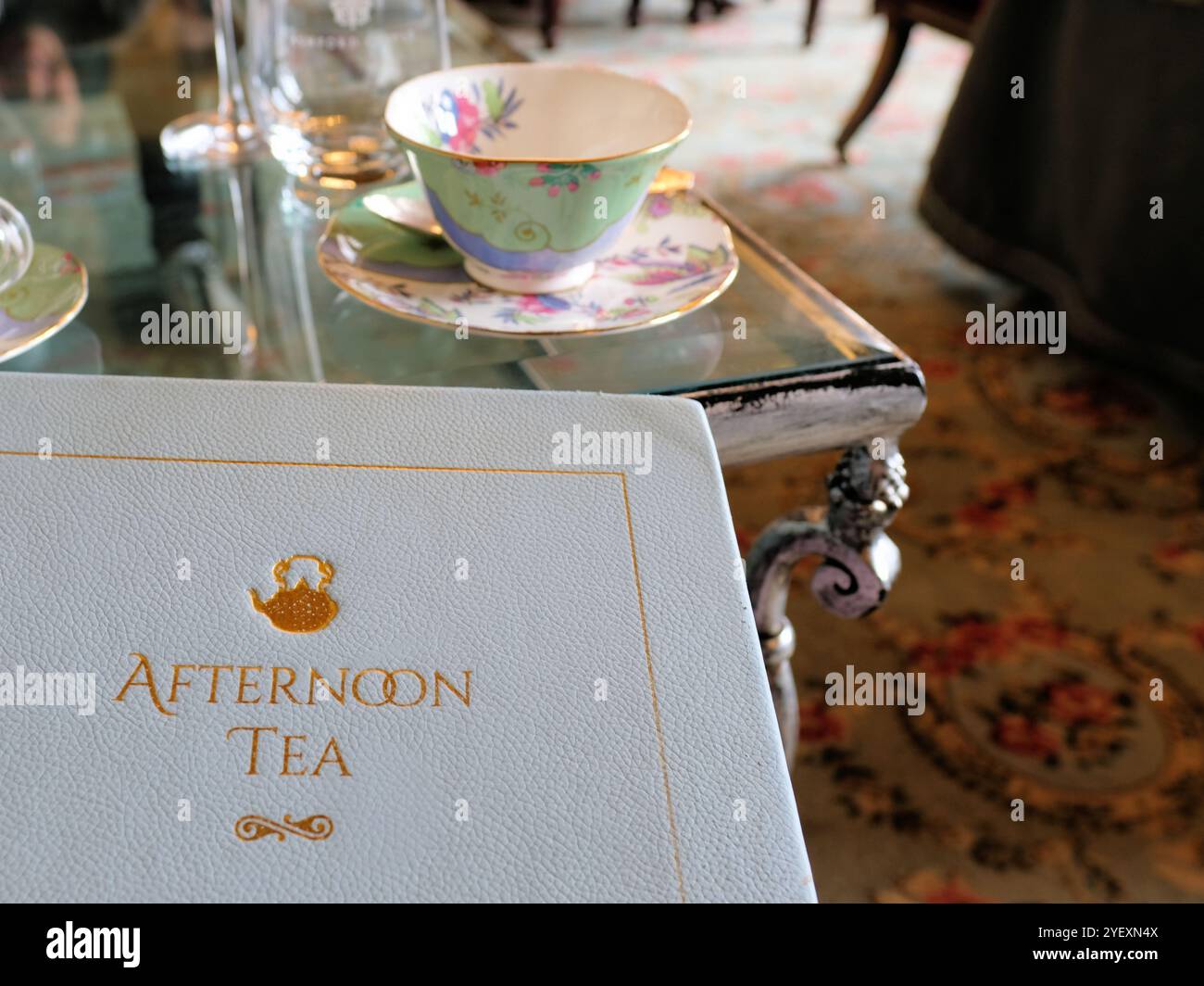 High Tea Letters White Afternoon Tea hardcover menu with table settings in background ...